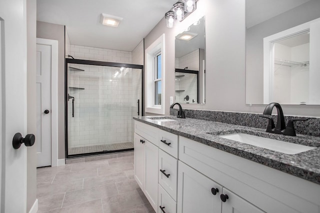 2141 N 35th St, Galesburg, MI 49053 - full bathroom featuring double vanity, a shower stall, and a walk in closet