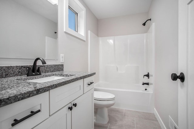 2141 N 35th St, Galesburg, MI 49053 - full bathroom featuring toilet, vanity, shower / bathtub combination, baseboards, and tile patterned floors