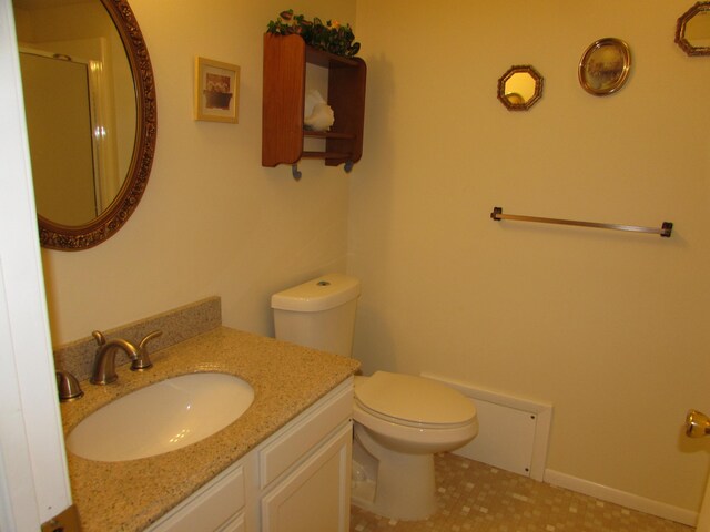 9920 Cambridge Ct, South Lyon, MI 48178 - bathroom featuring toilet, vanity, and a shower with shower door