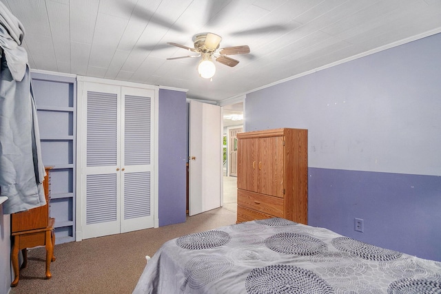 4468 Teal Ln, Newaygo, MI 49337 - carpeted bedroom with a closet, crown molding, and a ceiling fan