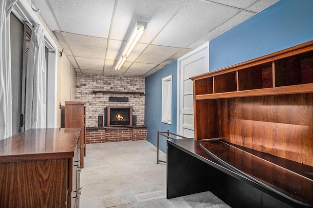 4468 Teal Ln, Newaygo, MI 49337 - unfurnished office with a drop ceiling, carpet floors, and a fireplace