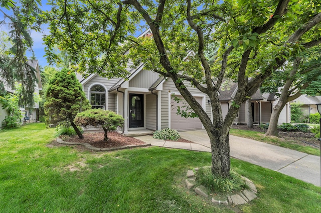 2539 Country Village Ct, Ann Arbor, MI 48103 - view of property hidden behind natural elements featuring driveway, a garage, and a front yard
