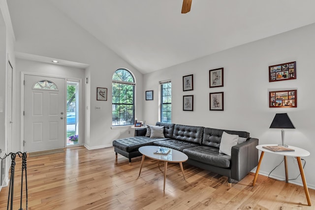 2539 Country Village Ct, Ann Arbor, MI 48103 - living area with light wood-style floors, baseboards, ceiling fan, and high vaulted ceiling