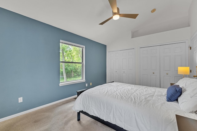 2539 Country Village Ct, Ann Arbor, MI 48103 - carpeted bedroom with two closets, lofted ceiling, baseboards, and a ceiling fan