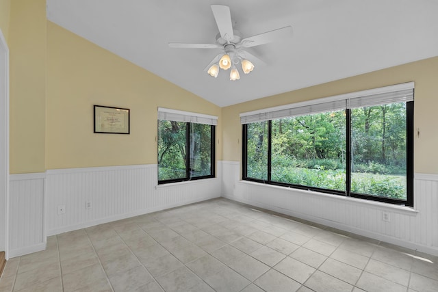 2539 Country Village Ct, Ann Arbor, MI 48103 - tiled spare room with wainscoting, vaulted ceiling, healthy amount of natural light, and a ceiling fan