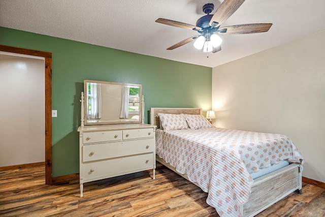 4744 Sandy Ln, Whitehall, MI 49461 - bedroom featuring wood finished floors, baseboards, and ceiling fan