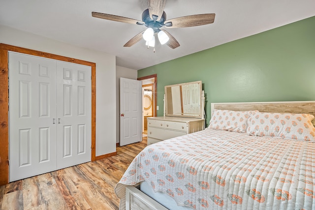 4744 Sandy Ln, Whitehall, MI 49461 - bedroom with light wood-style floors, a closet, baseboards, and a ceiling fan