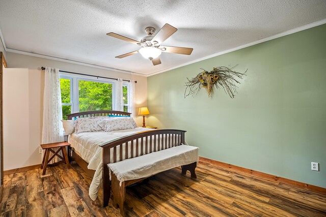 4744 Sandy Ln, Whitehall, MI 49461 - bedroom featuring ornamental molding, wood finished floors, a textured ceiling, ceiling fan, and baseboards