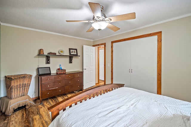 4744 Sandy Ln, Whitehall, MI 49461 - bedroom featuring wood finished floors, crown molding, ceiling fan, and a closet