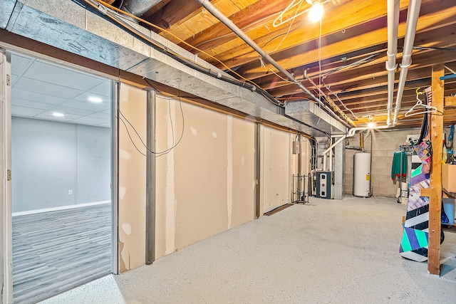 4744 Sandy Ln, Whitehall, MI 49461 - unfinished basement with gas water heater, heating unit, and recessed lighting