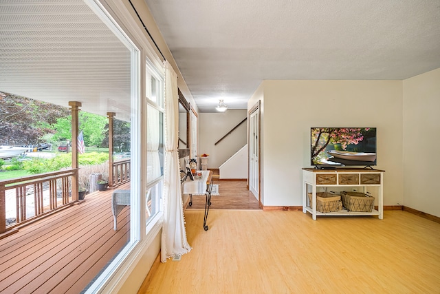 4744 Sandy Ln, Whitehall, MI 49461 - interior space with wood finished floors, baseboards, and stairway