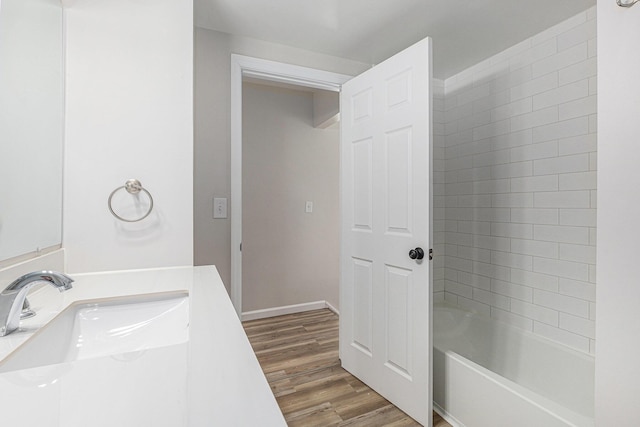 1335 Knapp St NE, Grand Rapids, MI 49505 - full bathroom with wood finished floors, vanity, and shower / washtub combination