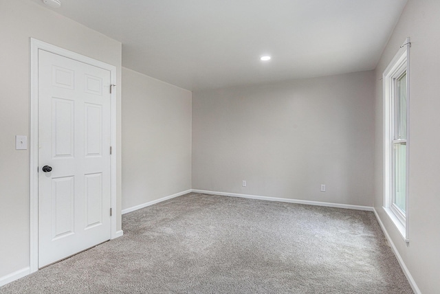 1335 Knapp St NE, Grand Rapids, MI 49505 - carpeted empty room featuring baseboards and recessed lighting