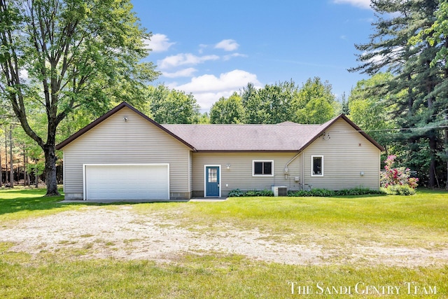 7120 Quarterline Rd, Spring Lake, MI 49456 - view of front of home featuring a garage, a front yard, dirt driveway, and roof with shingles
