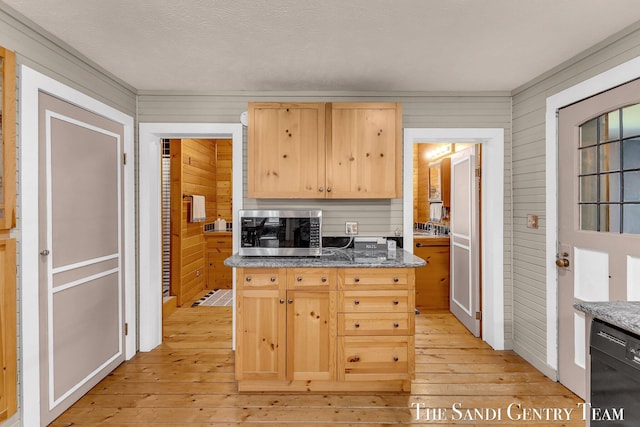 7120 Quarterline Rd, Spring Lake, MI 49456 - kitchen featuring light brown cabinets, dishwasher, light wood finished floors, stainless steel microwave, and wood walls
