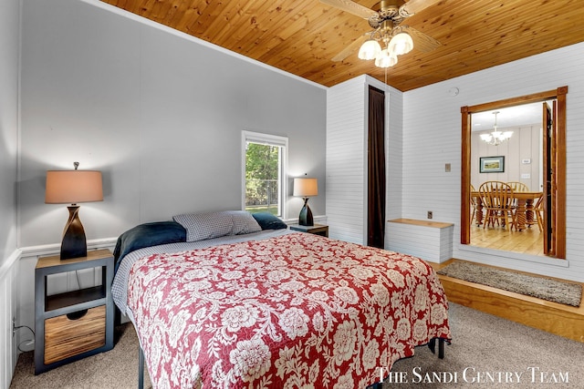 7120 Quarterline Rd, Spring Lake, MI 49456 - carpeted bedroom with a chandelier, crown molding, ceiling fan, wooden walls, and wooden ceiling
