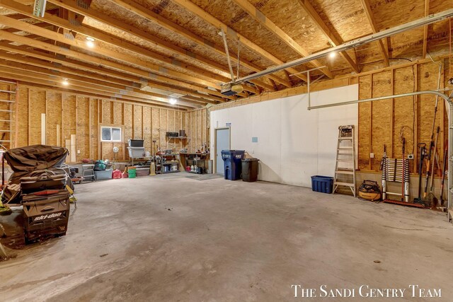 7120 Quarterline Rd, Spring Lake, MI 49456 - garage featuring a garage door opener