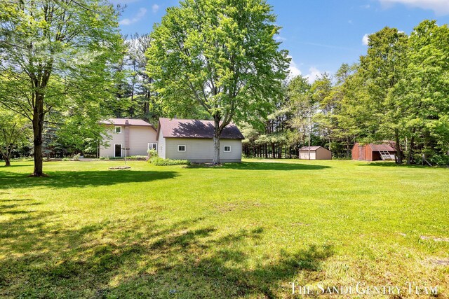 7120 Quarterline Rd, Spring Lake, MI 49456 - view of grassy yard with view of wooded area