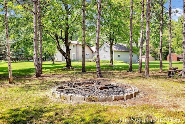 7120 Quarterline Rd, Spring Lake, MI 49456 - view of green lawn featuring a fire pit