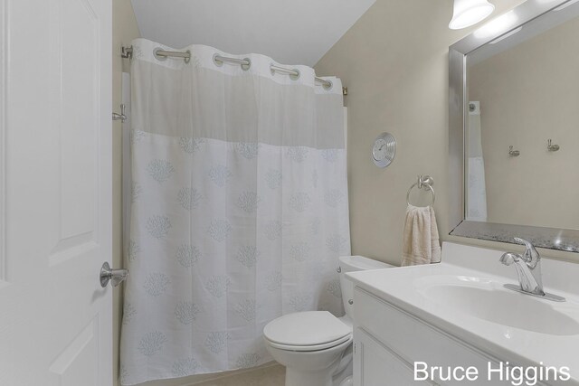 614 Oriole Ct Unit 7, Middleville, MI 49333 - bathroom featuring toilet, vanity, and a shower with curtain