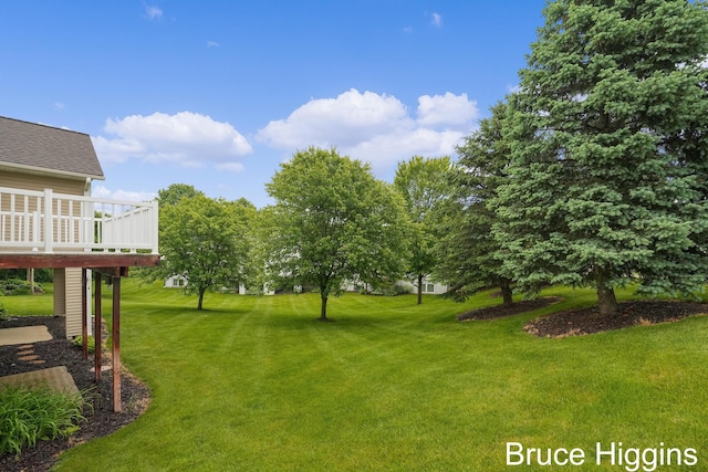 614 Oriole Ct Unit 7, Middleville, MI 49333 - view of green lawn featuring a deck