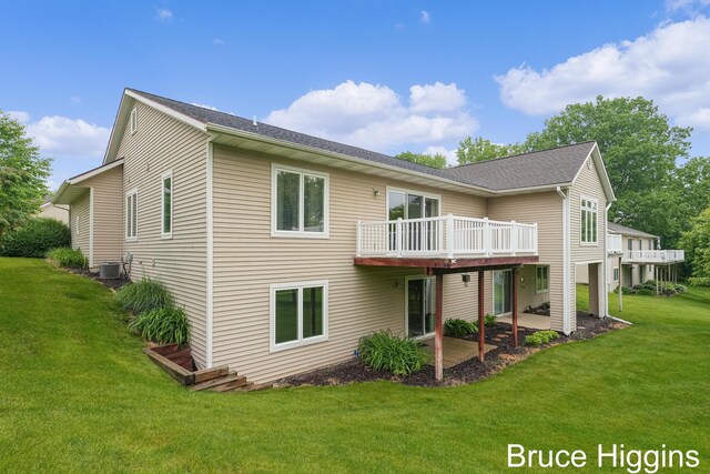 614 Oriole Ct Unit 7, Middleville, MI 49333 - back of house featuring a lawn, a patio area, a wooden deck, and central AC unit