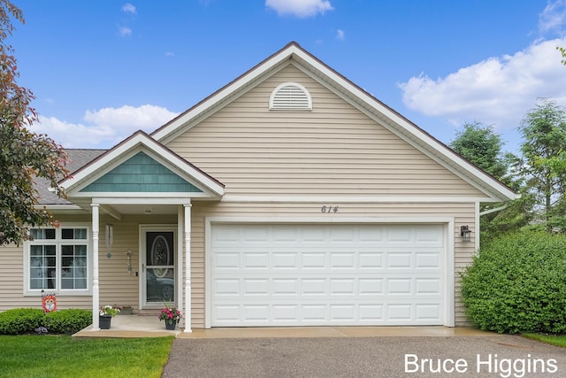 614 Oriole Ct Unit 7, Middleville, MI 49333 - view of front of home with asphalt driveway and a garage