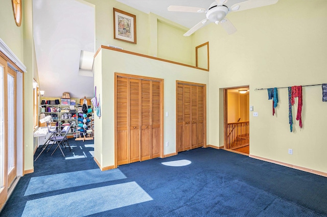 5700 Dexter Townhall Rd, Dexter, MI 48130 - entryway with a towering ceiling, carpet, ceiling fan, and baseboards