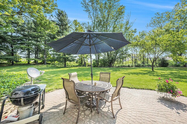 5700 Dexter Townhall Rd, Dexter, MI 48130 - view of patio / terrace with outdoor dining space and view of wooded area