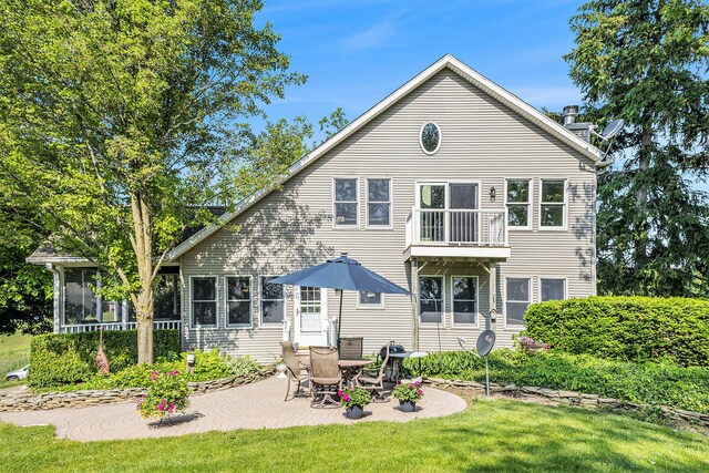5700 Dexter Townhall Rd, Dexter, MI 48130 - back of property featuring a patio area, a sunroom, a lawn, and a balcony