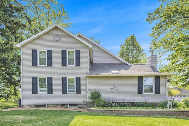 5700 Dexter Townhall Rd, Dexter, MI 48130 - view of front of property with a chimney, a front lawn, a shingled roof, and central AC unit