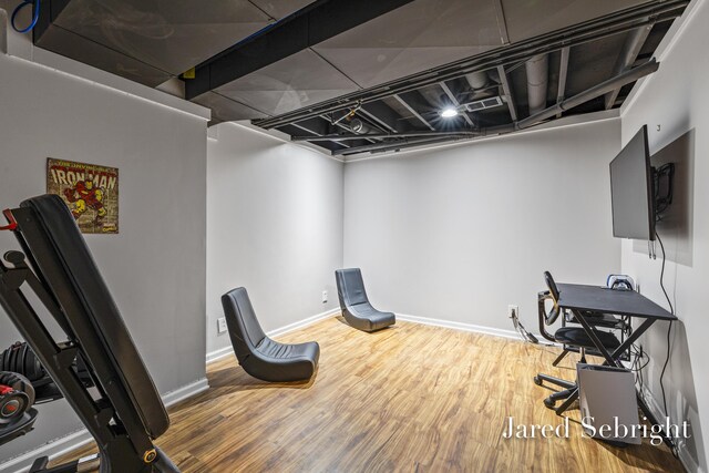 6872 Forest Valley Dr SE, Grand Rapids, MI 49546 - unfurnished office featuring wood finished floors and baseboards