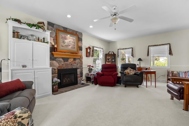 7572 S 10th St, Kalamazoo, MI 49009 - carpeted living room with a stone fireplace, healthy amount of natural light, ceiling fan, and recessed lighting