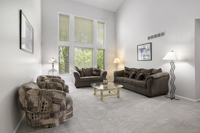 5448 Waterfield Ct, Ann Arbor, MI 48108 - living area featuring carpet and a towering ceiling