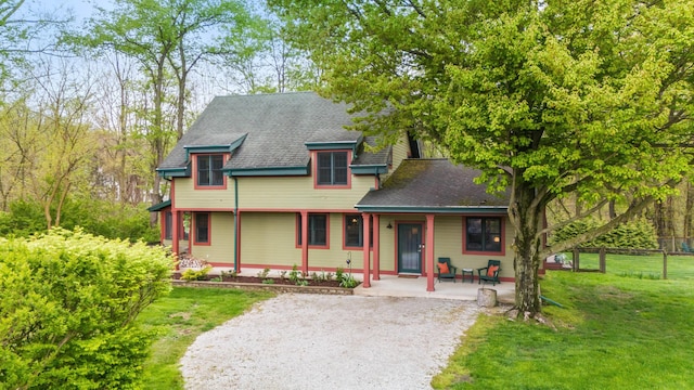 16434 S Basswood Rd, Three Oaks, MI 49128 - victorian house featuring covered porch and a shingled roof