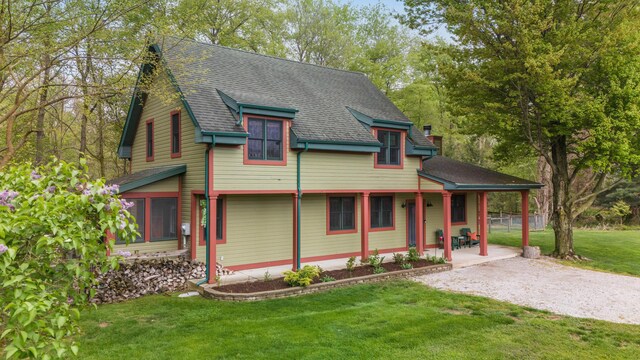 16434 S Basswood Rd, Three Oaks, MI 49128 - victorian home featuring a front lawn and a shingled roof