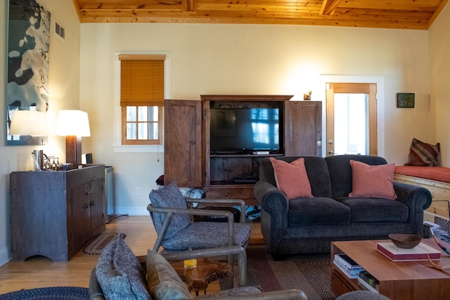 16434 S Basswood Rd, Three Oaks, MI 49128 - living room featuring wooden ceiling with exposed beams, baseboards, and light wood finished floors