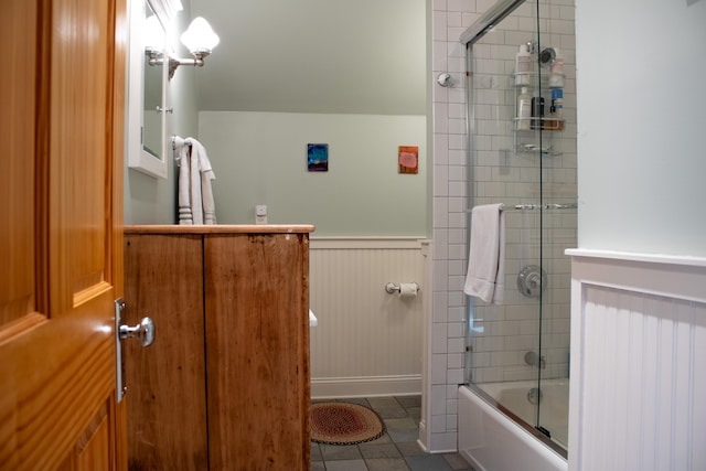 16434 S Basswood Rd, Three Oaks, MI 49128 - full bath featuring wainscoting, tile patterned floors, combined bath / shower with glass door, and baseboards