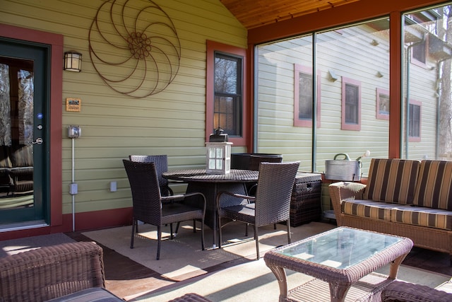 16434 S Basswood Rd, Three Oaks, MI 49128 - sunroom / solarium featuring outdoor dining space and lofted ceiling