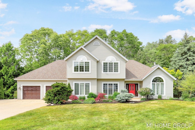 2103 Woodlark Dr, Holland, MI 49424 - view of front of house featuring concrete driveway, a garage, roof with shingles, and a front yard