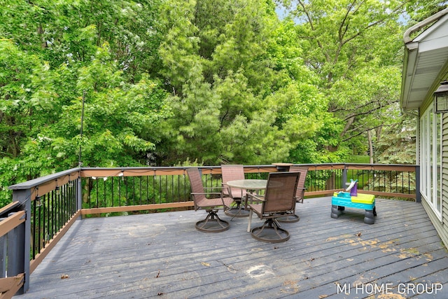 2103 Woodlark Dr, Holland, MI 49424 - wooden terrace featuring outdoor dining space