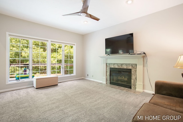 2103 Woodlark Dr, Holland, MI 49424 - living area featuring carpet, a ceiling fan, baseboards, a tiled fireplace, and recessed lighting
