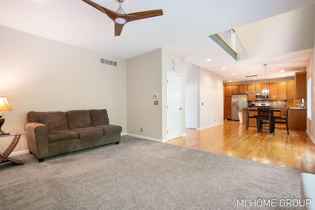 2103 Woodlark Dr, Holland, MI 49424 - living area featuring light colored carpet, recessed lighting, baseboards, and ceiling fan