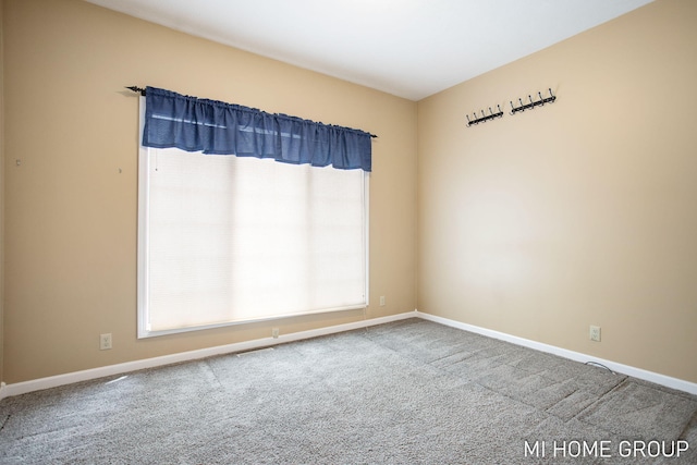 2103 Woodlark Dr, Holland, MI 49424 - carpeted spare room featuring baseboards
