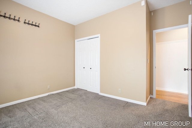 2103 Woodlark Dr, Holland, MI 49424 - unfurnished bedroom with carpet floors, a closet, and baseboards