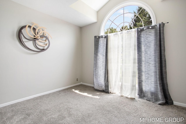 2103 Woodlark Dr, Holland, MI 49424 - carpeted empty room with baseboards and lofted ceiling