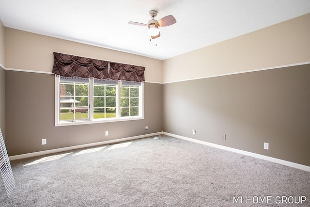 2103 Woodlark Dr, Holland, MI 49424 - empty room featuring carpet flooring, baseboards, and ceiling fan