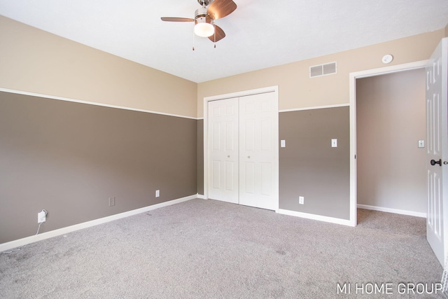2103 Woodlark Dr, Holland, MI 49424 - unfurnished bedroom featuring carpet flooring, a closet, baseboards, and ceiling fan