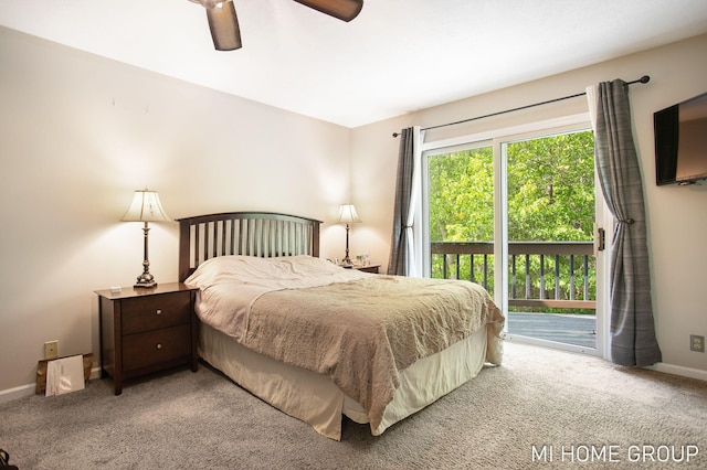 2103 Woodlark Dr, Holland, MI 49424 - carpeted bedroom featuring access to exterior, baseboards, and a ceiling fan