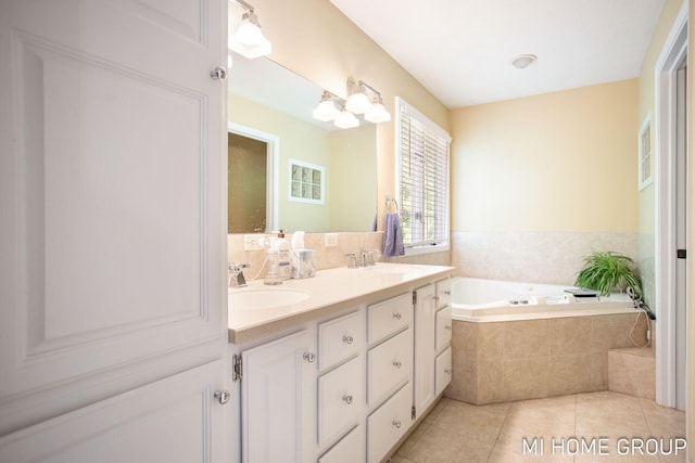 2103 Woodlark Dr, Holland, MI 49424 - full bathroom with a bath, double vanity, and tile patterned flooring